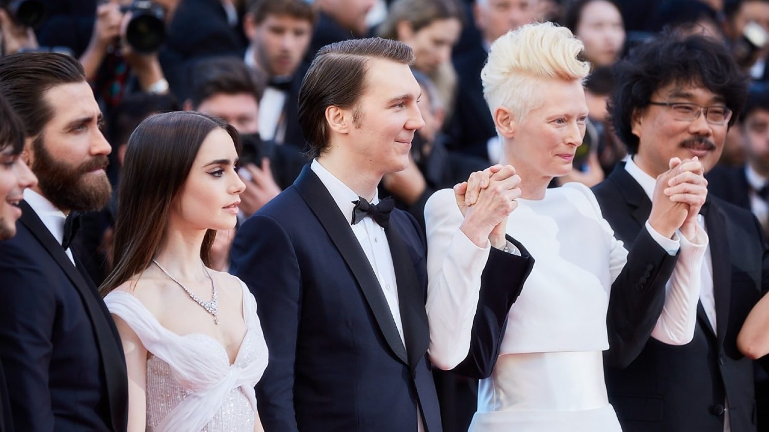 CANNES, FRANCE - MAY 19:  Actors Devon Bostic, Jake Gyllenhaal, Lily Collins, Paul Dano, Tilda Swinton, director Bong Joon-Ho attend the "Okja" screening during the 70th annual Cannes Film Festival at Palais des Festivals on May 19, 2017 in Cannes, France. (Photo by Kristina Nikishina/Epsilon)